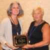 Pilar Wyman (L) receives the 2017 Hines Award from chair Sandi Schroeder.